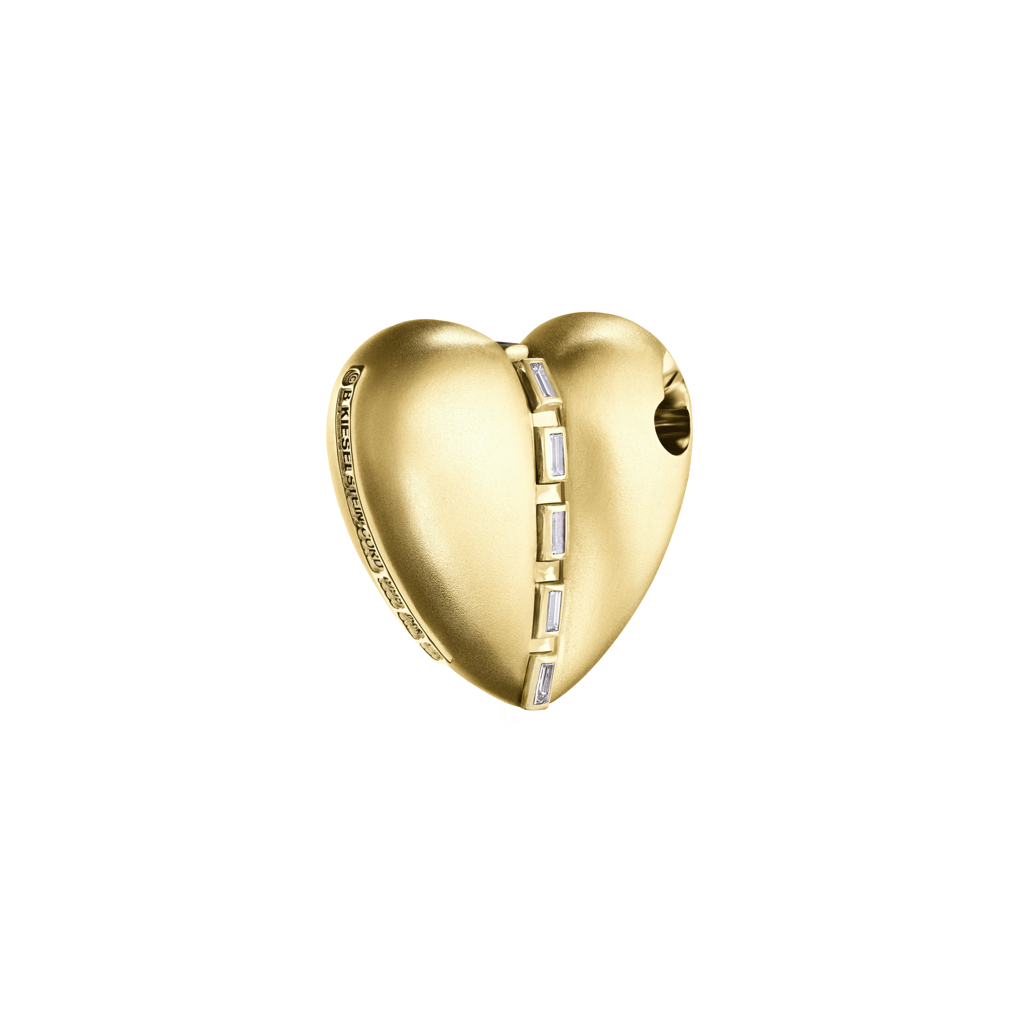A detail of Bullet Hole Heart Pendant with Baguettes in Yellow Gold